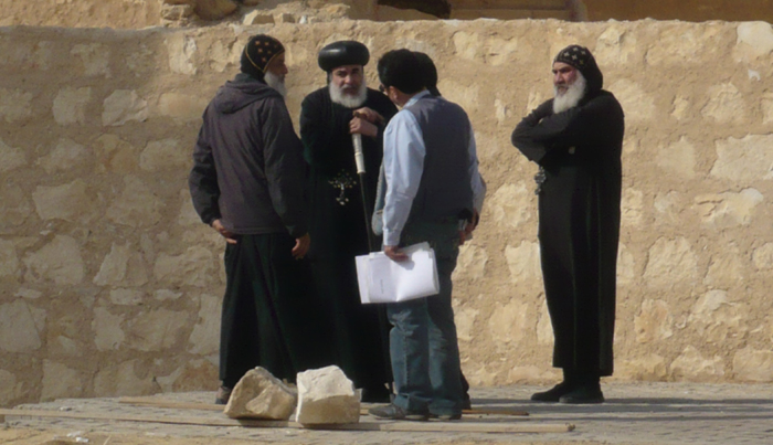Given their importance and longevity, building projects usually received at least some sort of input from the head of the religious establishment. This is true even today. Seen here, the Bishop of St Anthony's Monastery in Egypt discusses the construction of a new building on-site with his architects and two senior monks.